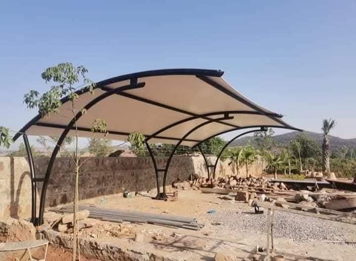 Black frame dual-arch tensile shade structure